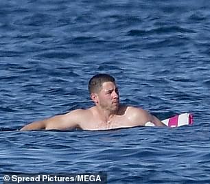 He used his arms to get closer to the boat ladder as he tried to get out of the water