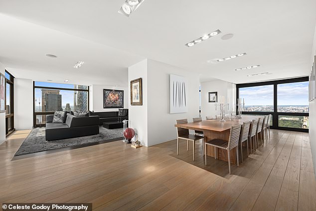 Wide hardwood floors run throughout the 3,500 square foot apartment