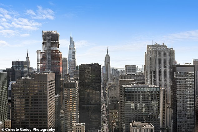 Looking south along Fifth Avenue, the concrete jungle of New York City is clearly visible