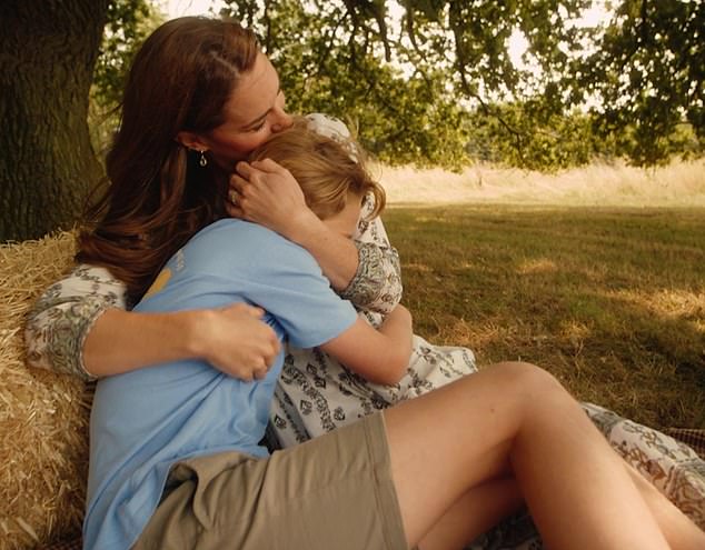 Catherine kisses her eldest's head in a tender embrace