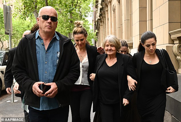 Joyleen Robinson arrives at the court during the trial with her husband Peter (left) and daughters