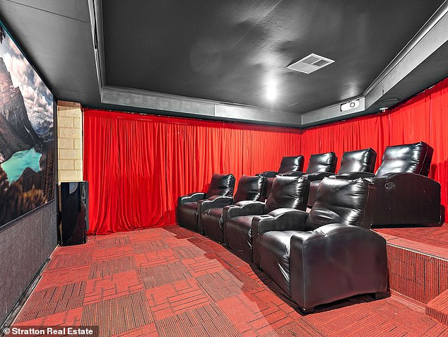 The renovated three-bedroom home with a theater (pictured) is expected to cost more than $1 million after being purchased for just $525,000 in 2015