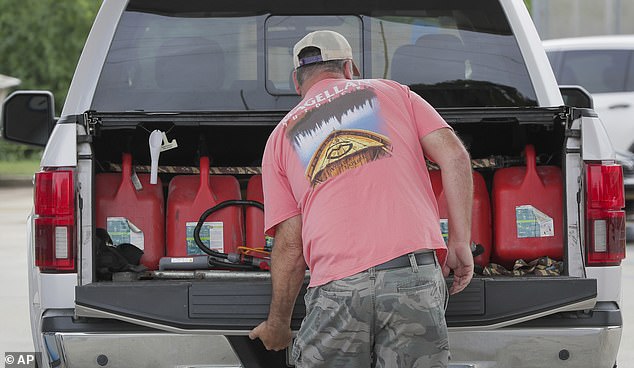 Steve Pete filled gas cylinders in Violet, Louisiana on Monday to give to neighbors and seniors in need ahead of Tropical Storm Francine