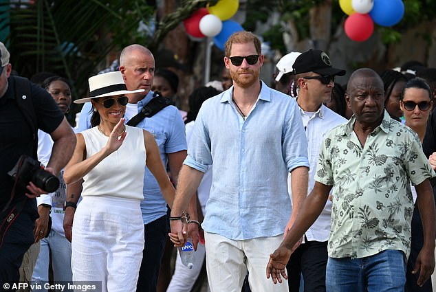 Prince Harry and Meghan, photographed in San Basilio de Palenque in Colombia on August 17