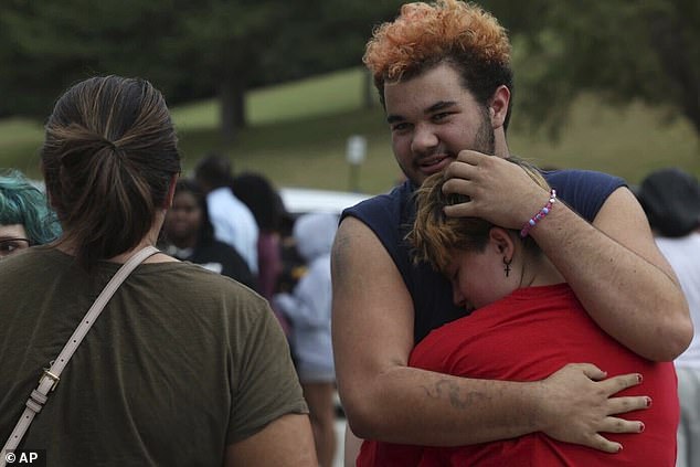 Police announced they had arrested a suspect about an hour into the lockdown, as parents and students gathered in a reunion room