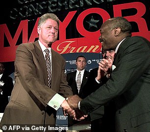 U.S. President Bill Clinton (left) shakes hands with San Francisco Mayor Willie Brown