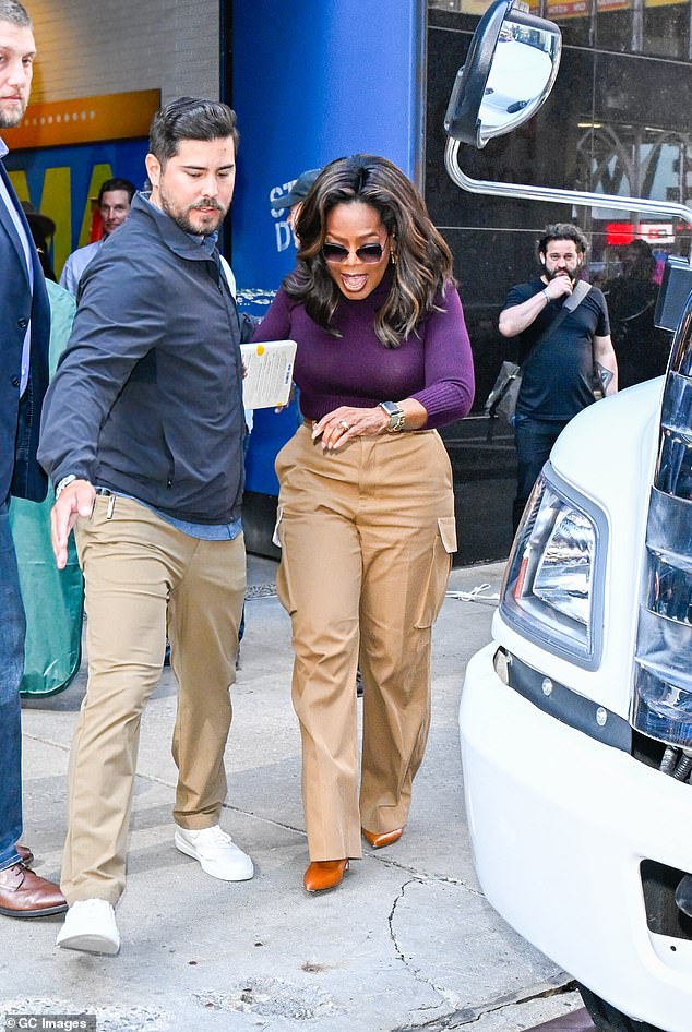 Oprah showed off her tiny waist as she walked