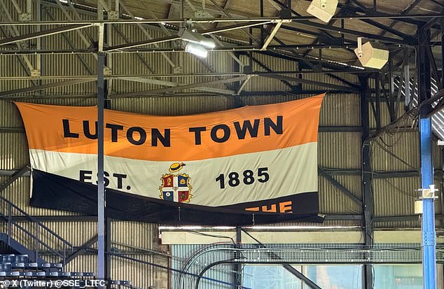 Luton had to cover part of the flag with the text: 'Betrayed by the FA 2008'