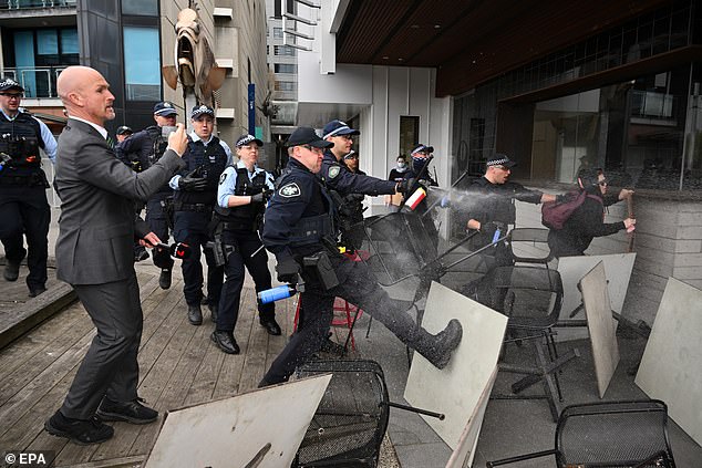 Pictured: Chaos and destruction in Melbourne as police use pepper spray on protesters on Wednesday