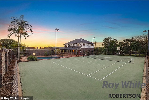 Two swimming pools, a tennis court, a gazebo and a patio await in the expansive backyard - perfect for hosting summer parties.