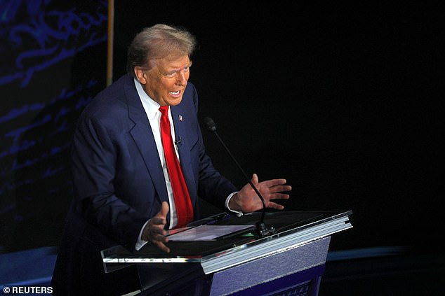 Republican presidential candidate, former US President Donald Trump, gestures while speaking during a presidential debate with Democratic presidential candidate, US Vice President Kamala Harris