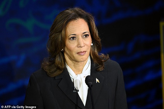 US Vice President and Democratic presidential candidate Kamala Harris listens to former US President and Republican presidential candidate Donald Trump speaking