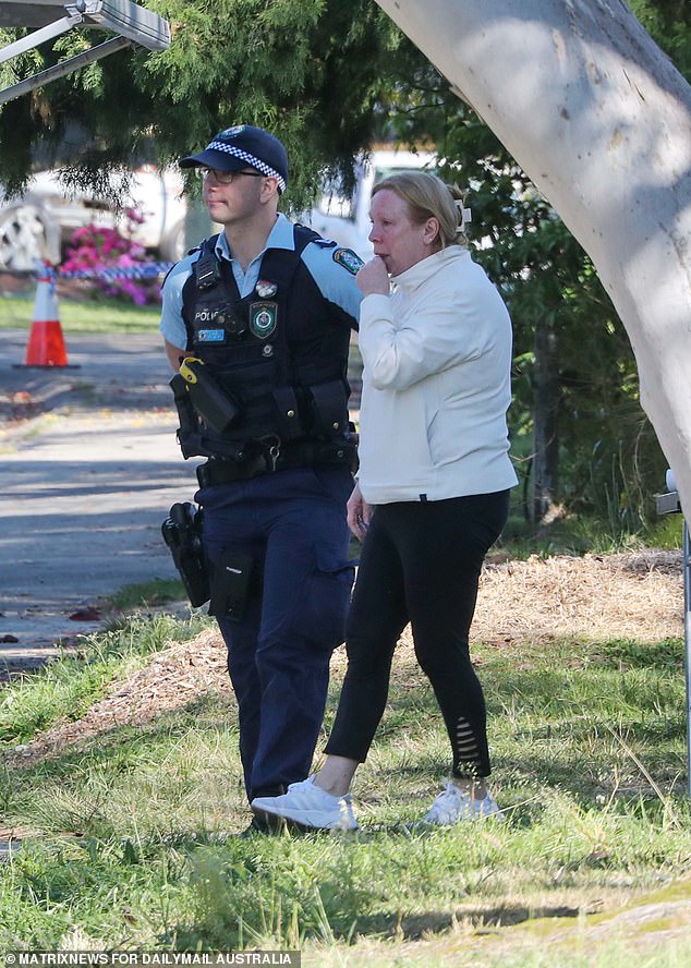 Residents began laying tributes at the home on Wednesday as investigators continued to investigate the crime scene