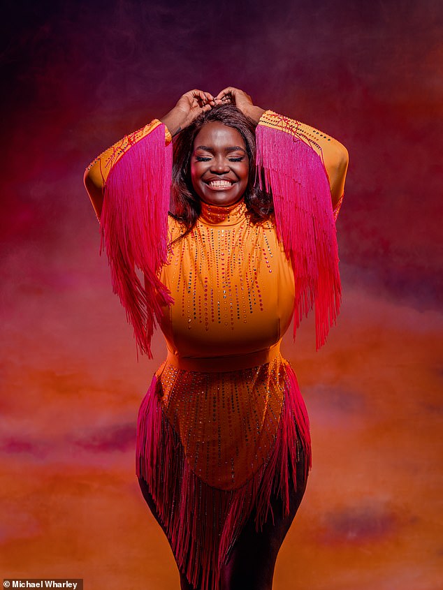 Oti stunned in an orange and pink tasselled dress during a stunning photoshoot for her tour