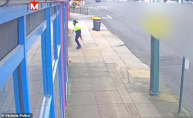 CCTV footage shows a man dancing through the street in a high-visibility vest after the attack