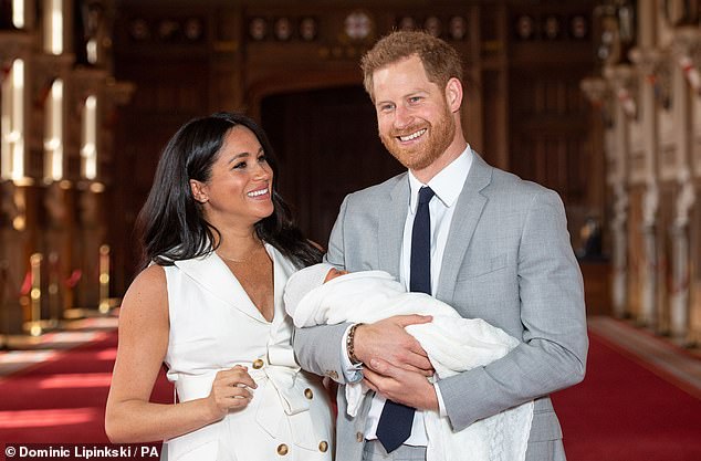 Harry and Meghan with Archie for his first public photo at Windsor Castle in May 2019