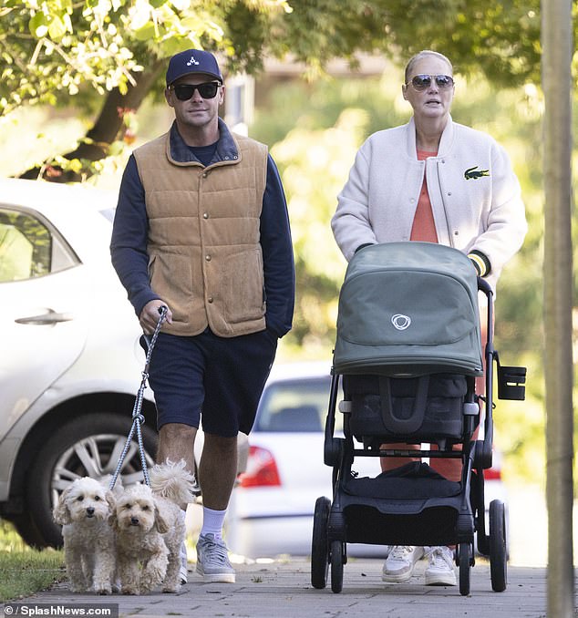 Ant cut a modest figure in a navy baseball cap and sunglasses as he walked his two maltipoo dogs Milo and Bumble