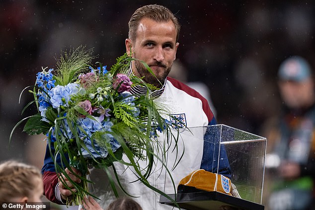 Kane was presented with a gold cap in honour of his 100th game for the Three Lions