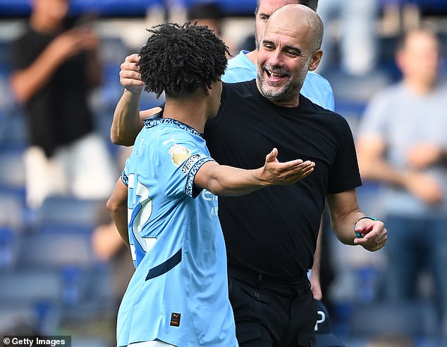 Lewis has now revealed what City manager Pep Guardiola (right) would likely say about his role with England