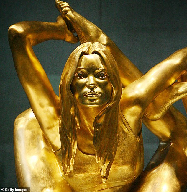 Amazing gold! This supermodel's statue made her look like you'd never seen her before