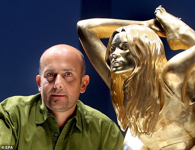 British artist Marc Quinn stands with his solid gold sculpture of British supermodel Kate Moss in the British Museum