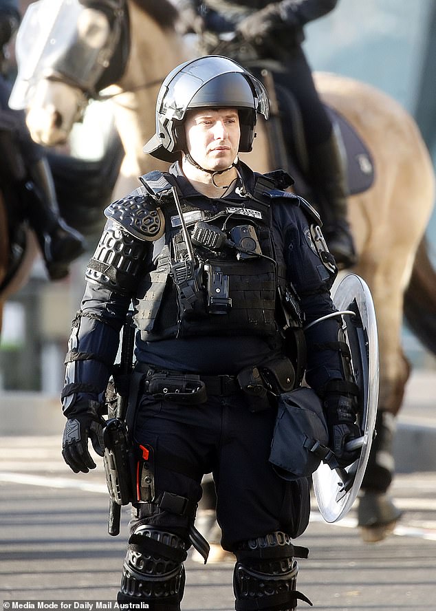 One of thousands of police officers deployed in Melbourne on Thursday