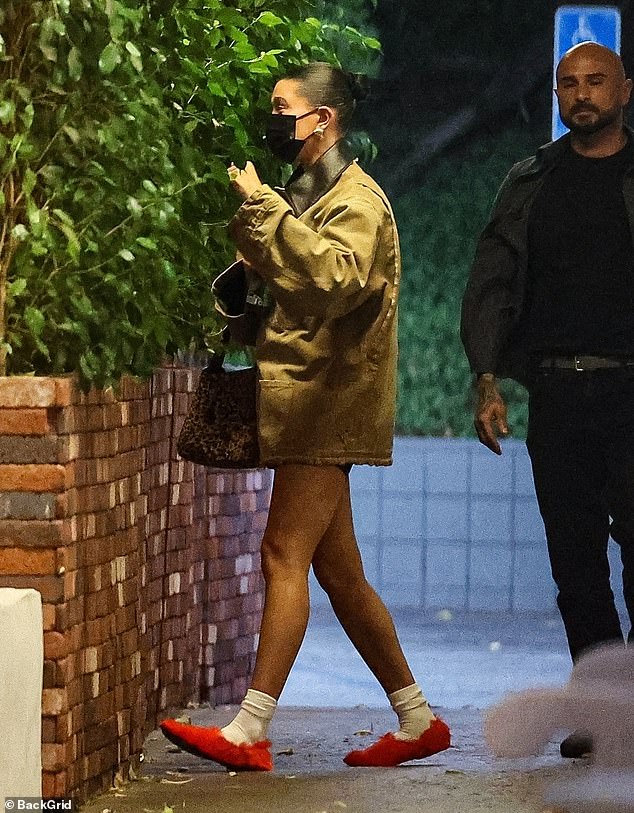 Hailey teamed her casual look with white socks and furry red ballerinas