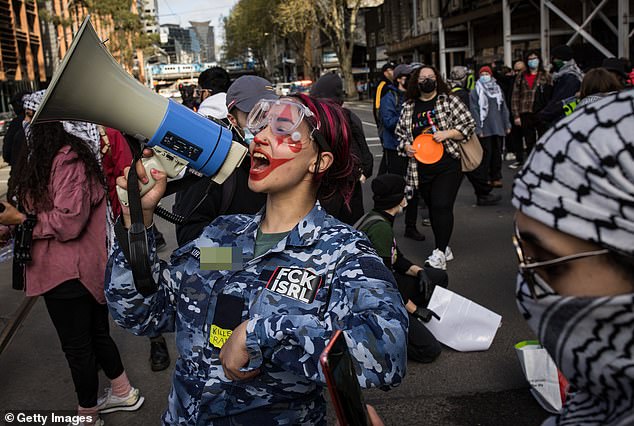 The appearance of this woman in an Australian Air Force cadet uniform sparked outrage, with online commentators calling for her immediate removal from the youth military program.