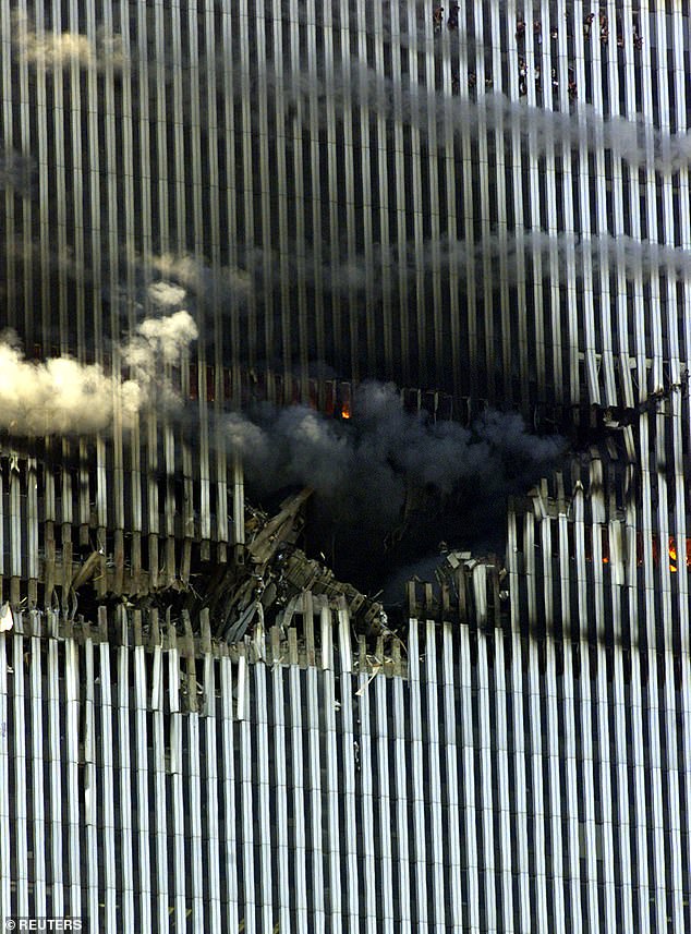 The gaping hole in the photo after a plane crashed into the North Towers of the World Trade Center