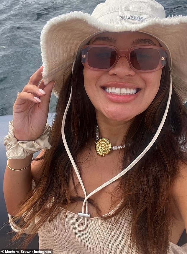 The TV star completed her outfit with a pearl choker with a gold shell in the middle and wore a Jacquemus bucket hat