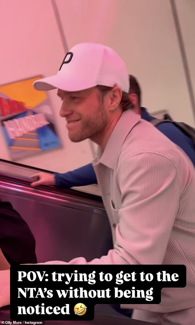 Olly shared a sweet update on his Instagram, which saw him shield his face with a baseball cap as he walked up the escalator and past posters of himself