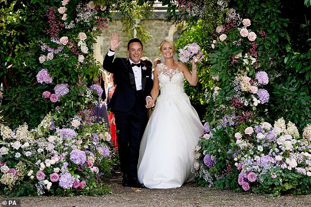 The baby is Ant's first, while Anne-Marie already has two children, Poppy and Daisy, from her previous marriage. A source said the couple feel their family is now 'complete' (pictured at their August 2021 wedding).