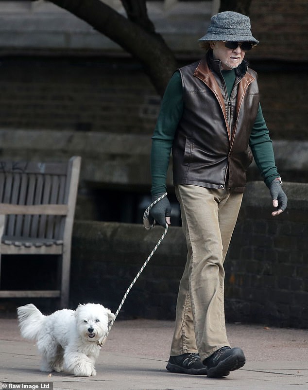 Pip was kept on a tight leash as Hucknall went out for a walk with the dog in North London