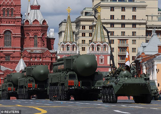 The current Russian nuclear doctrine, adopted in 2020, only allows for nuclear retaliation in the event of a nuclear attack or an existential threat. Pictured: A Russian BTR-82A armored personnel carrier and Yars intercontinental ballistic missile systems