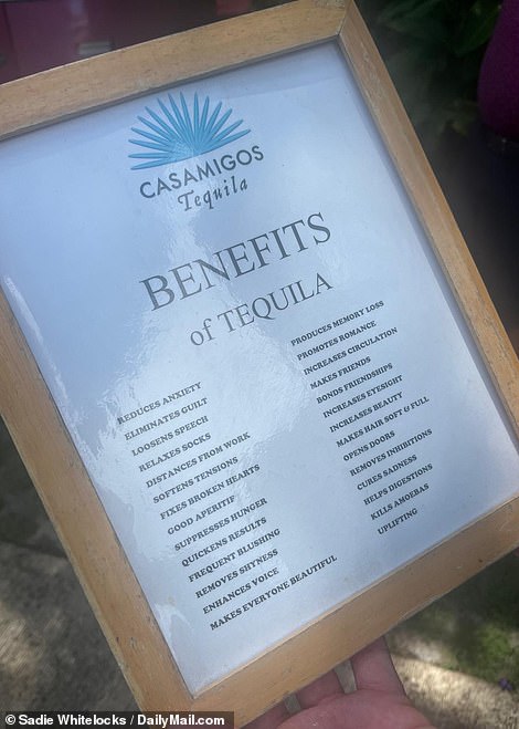 One of the signs on the golf course lists the benefits of drinking tequila, including 