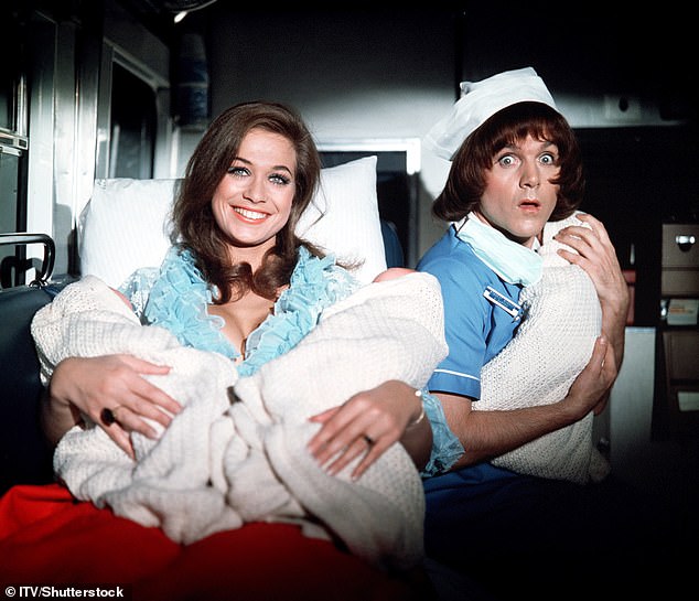 Cope is pictured in 1972's Carry On Matron with co-star Valerie Leon, left