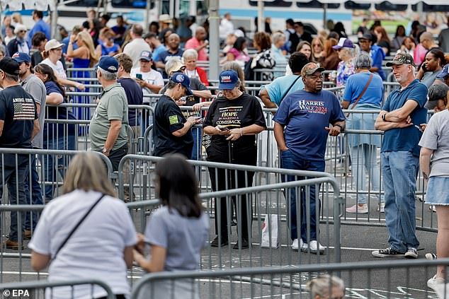 Attendees wait outside Bojangles Arena in Charlotte, NC for Kamala Harris' September 12 rally. Supporters at the front of the line told DailyMail.com they arrived around 9:30 a.m. to get in.