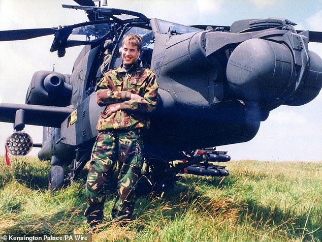 William is pictured leaning against a helicopter during a visit to the Army Air Corps in 1999