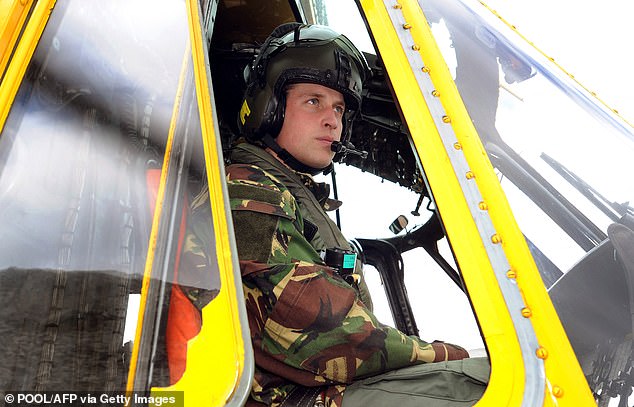 William is pictured at the controls of a Sea King helicopter during a training exercise on Holyhead Mountain after flying from RAF Valley in Anglesey, North Wales, on March 31, 2011.