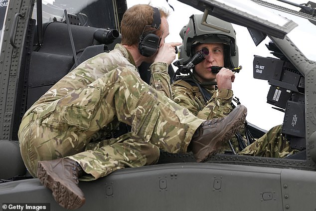 Prince William, Prince of Wales, sits in an Apache helicopter at the Army Aviation Centre in Middle Wallop, on May 13, 2024