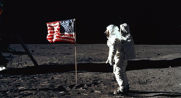 The American flag appears to be waving in this photo because there is a telescopic pole inserted into the top edge of the flag.