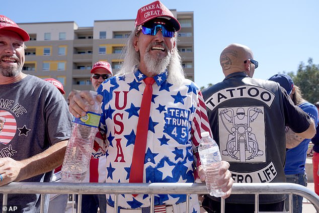 People lined up around the convention center, winding around parking lots in temperatures well above 100 degrees Fahrenheit to get a seat inside