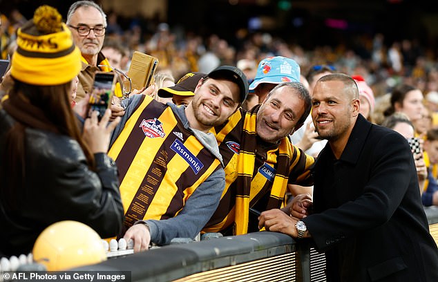 Franklin (pictured taking selfies with fans this season) fondly remembers his days with the Hawks