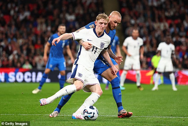 Anthony Gordon walked cautiously out of the Wembley dressing room - because of his bag