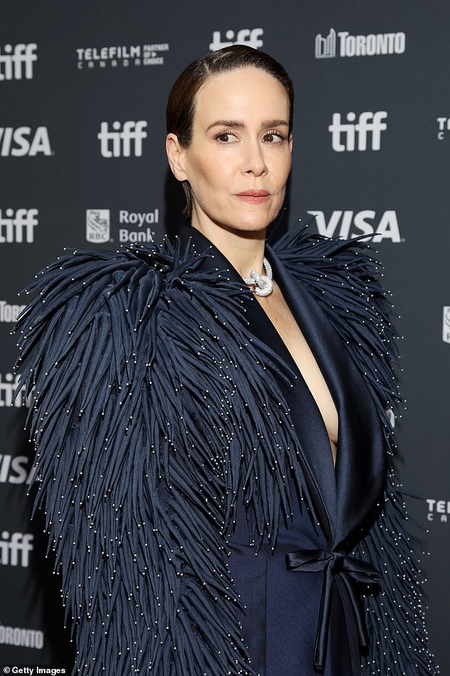 The 49-year-old American Horror Story alumna hit the red carpet in a daring look that saw her go topless under a plunging navy satin blazer by Schiaparelli