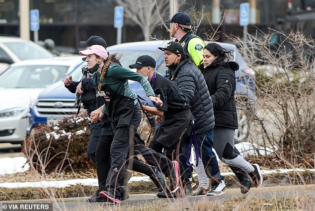 King Soopers employees are led away from the supermarket massacre in March 2021