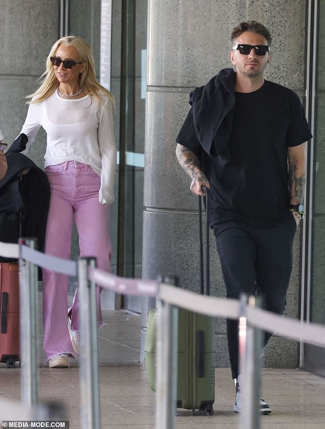 Tommy also looked relaxed in a black T-shirt and jeans, which he paired with high-top white and blue sneakers and a dark sweater