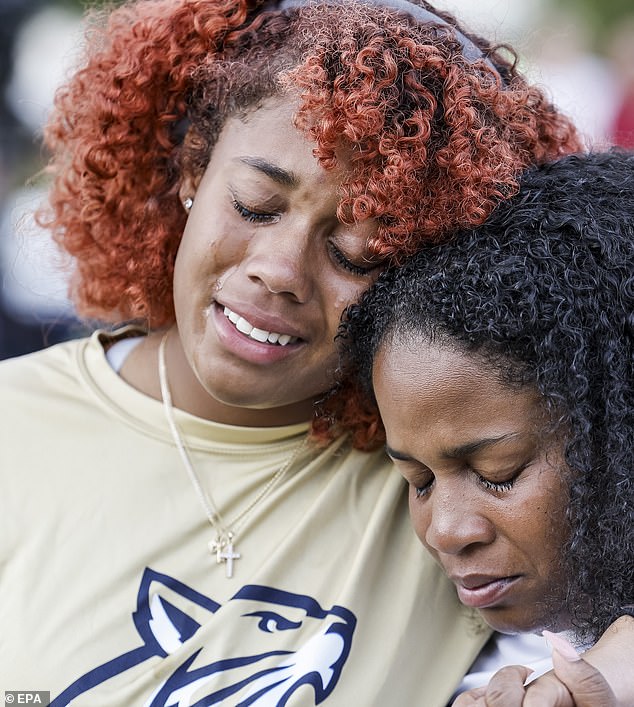 People cried during a vigil for the victims of Georgia's deadliest school shooting ever