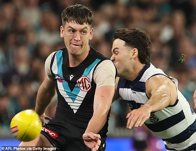 Butters (left) was substituted during Port Adelaide's heavy defeat to Geelong with a rib injury