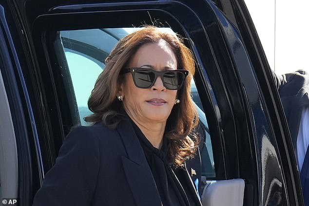 Democratic presidential candidate Vice President Kamala Harris steps out of her vehicle as she prepares to board Air Force Two